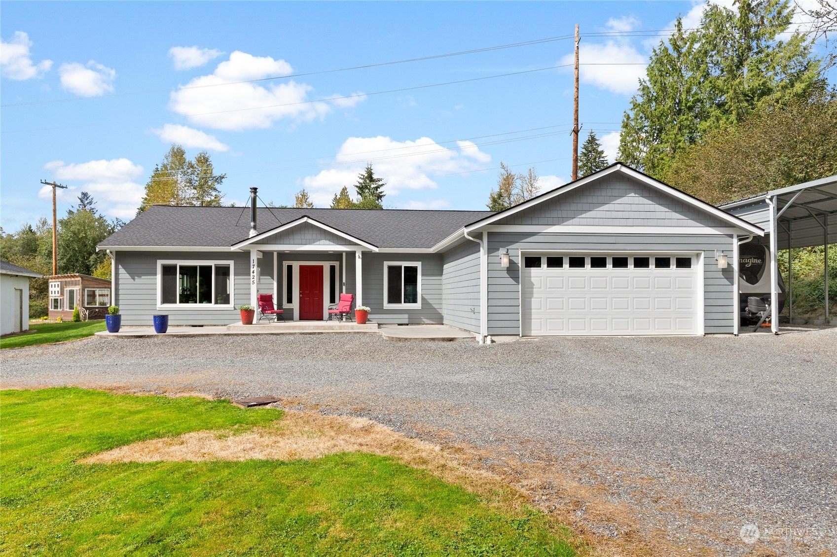 a front view of a house with a yard