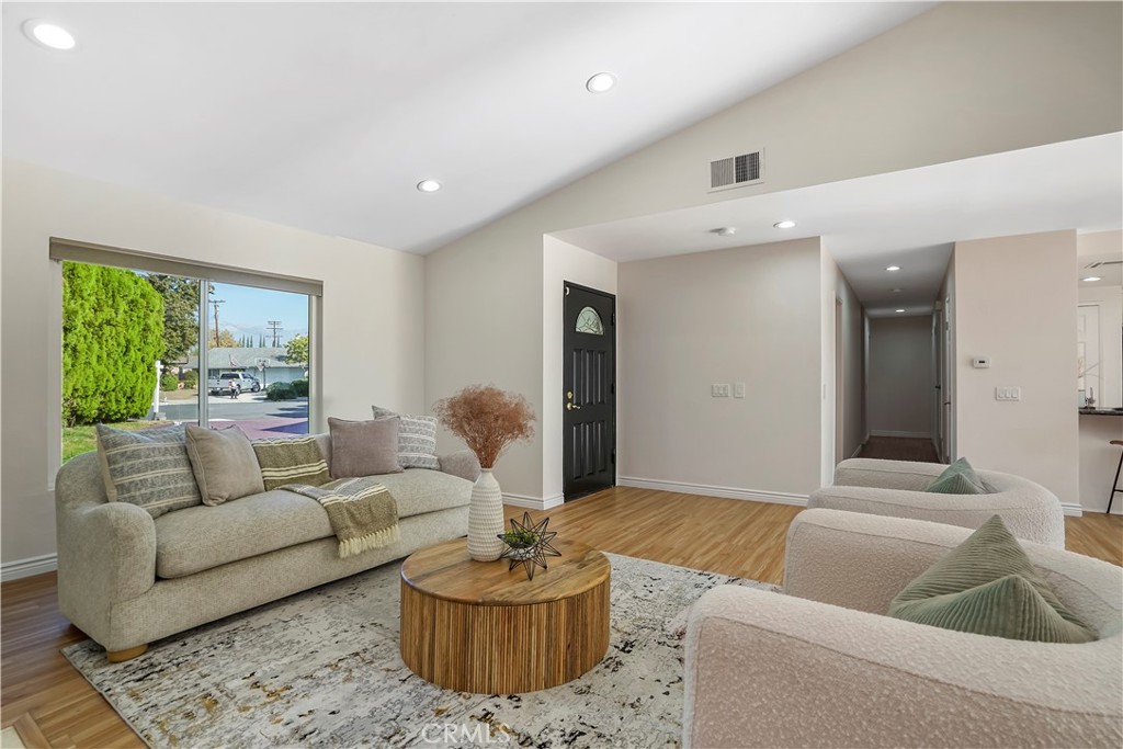 a living room with furniture and a large window