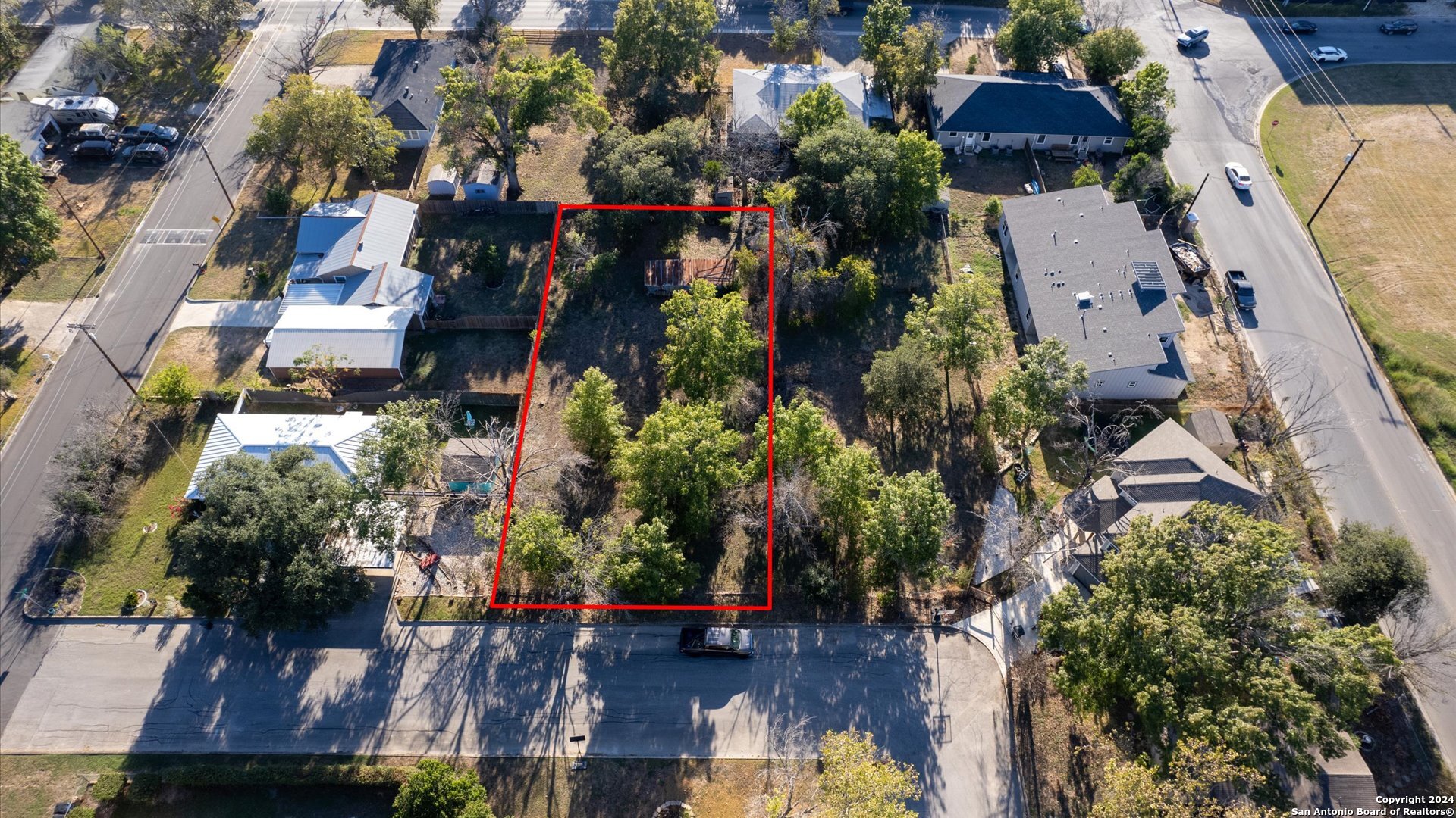 an aerial view of multiple houses with outdoor space