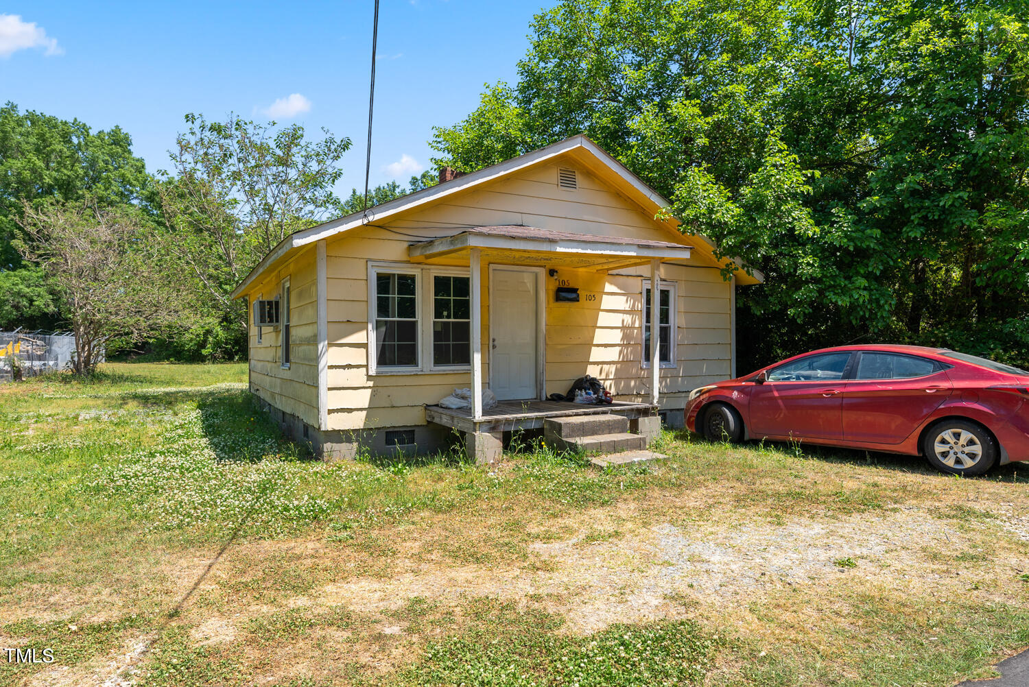 a front view of a house with yard and garage