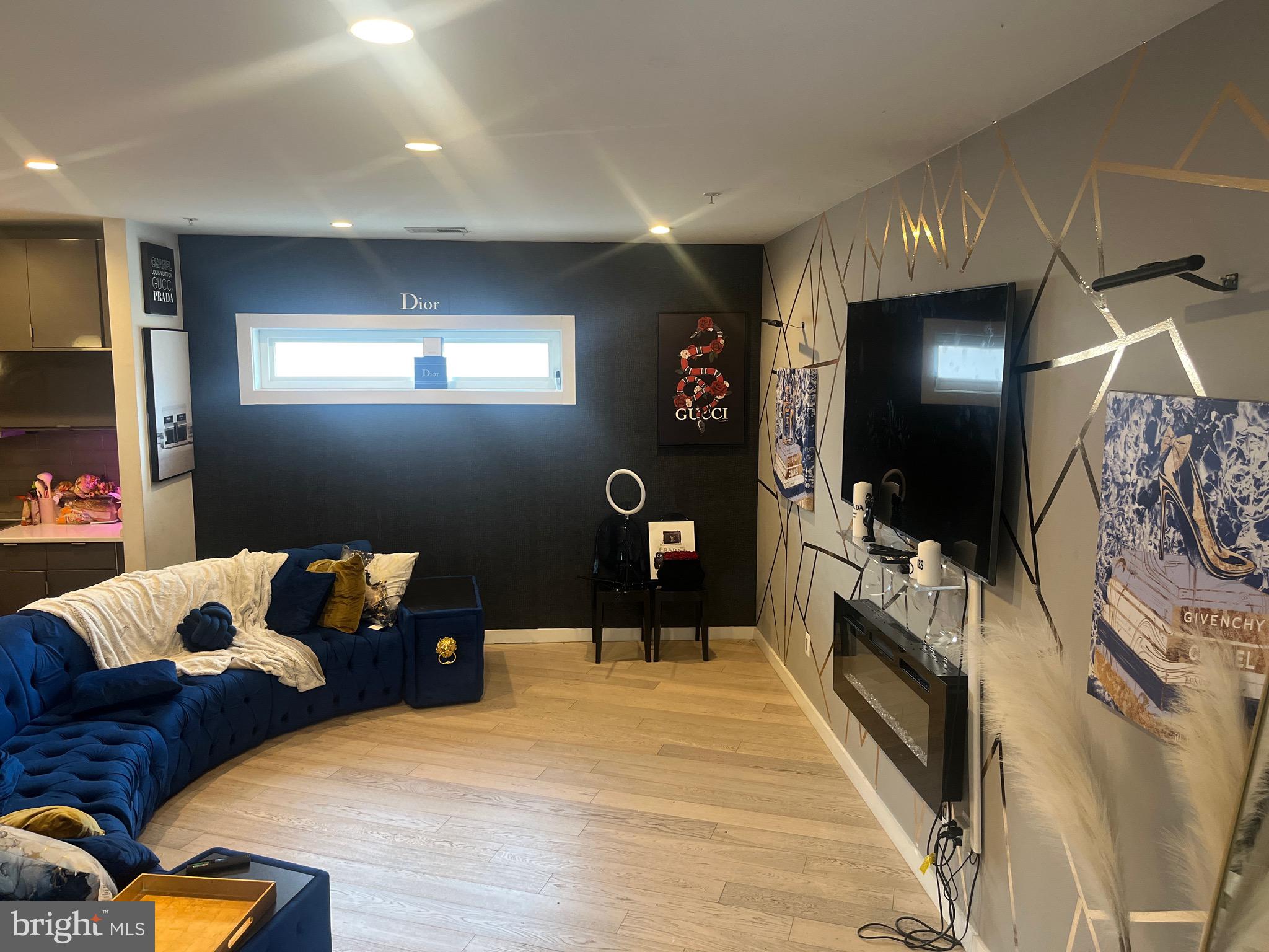 a bedroom with furniture and a flat screen tv