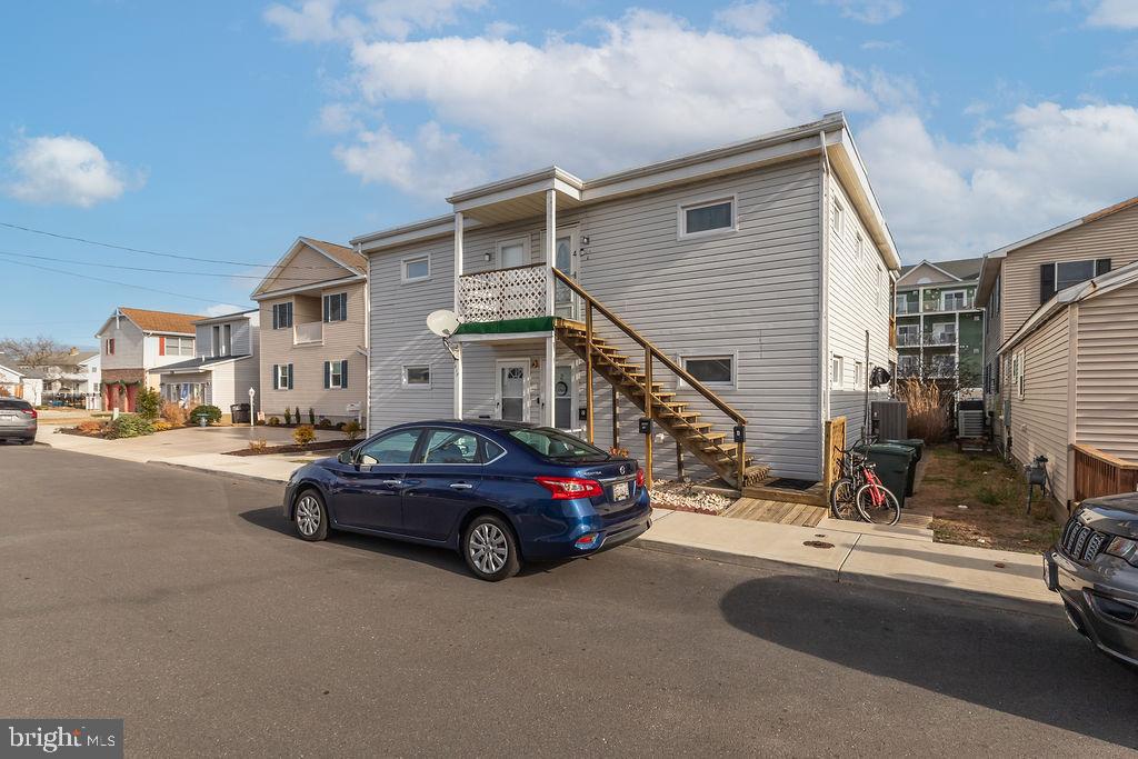 a view of a cars park in front of house