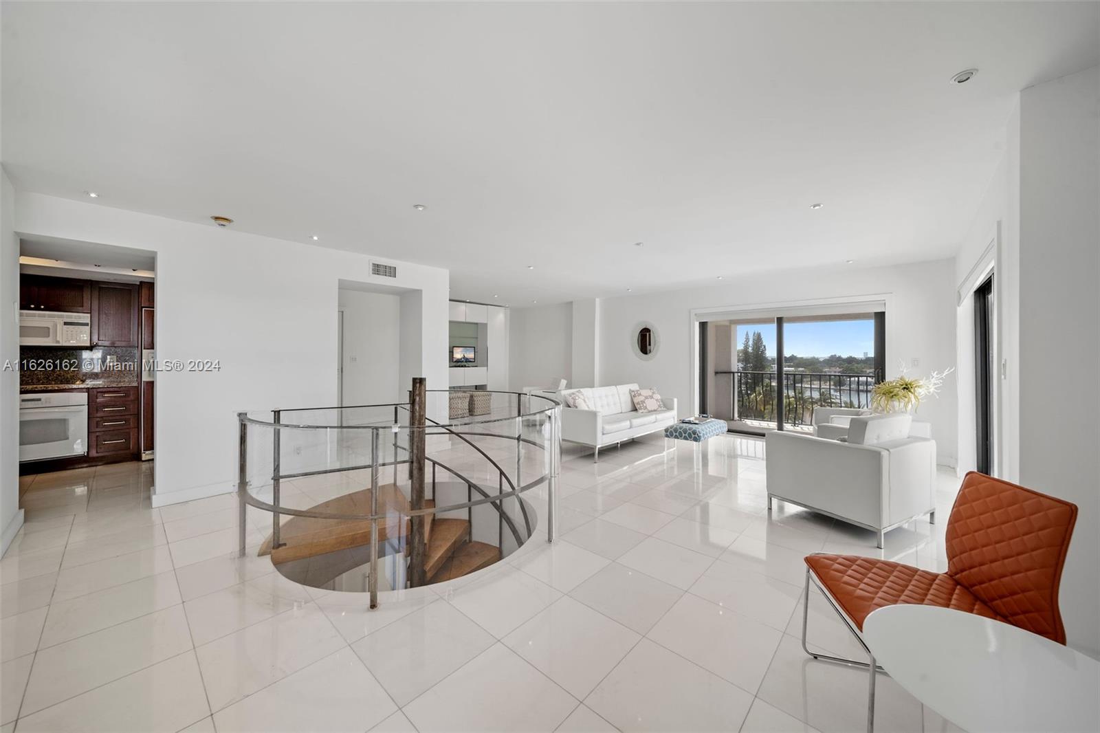 a living room with furniture and view of living room