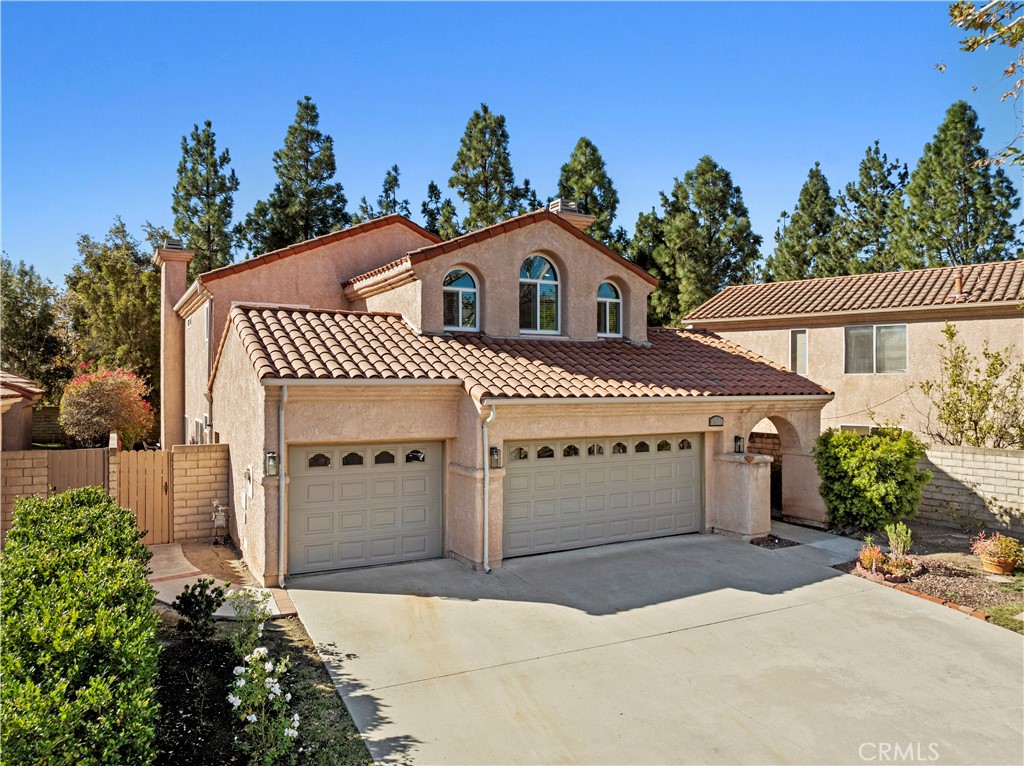 a front view of a house with a garage