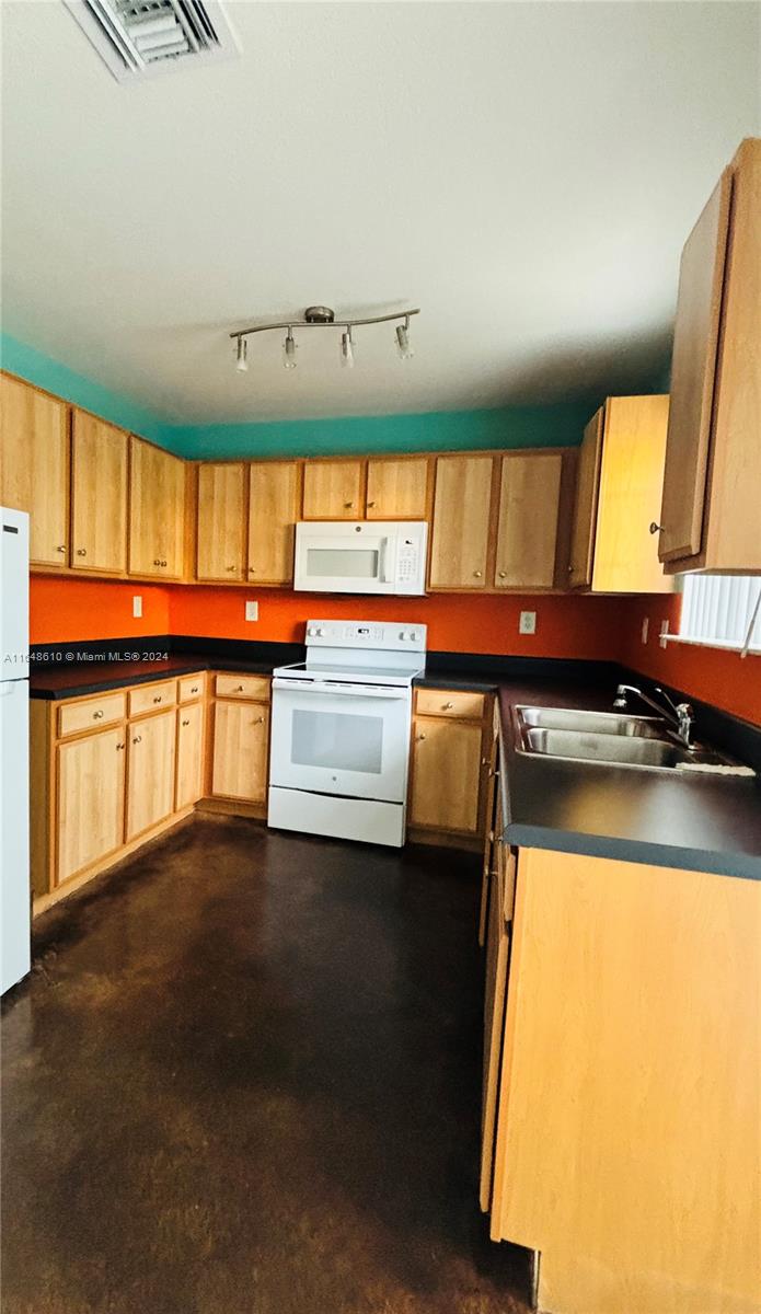 a view of a kitchen with a sink