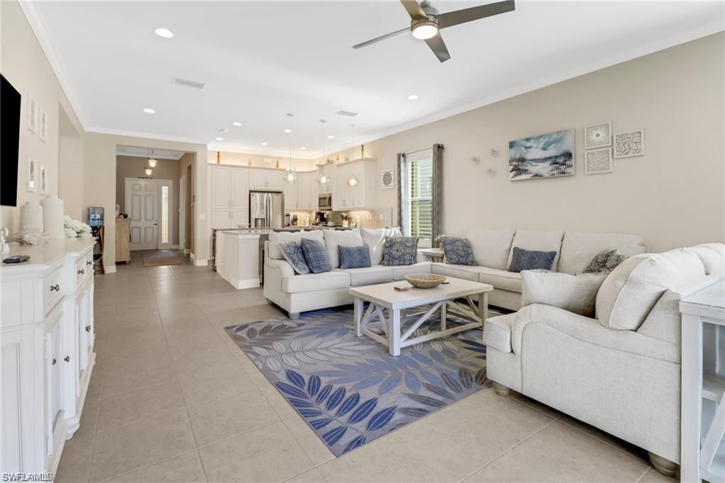 a living room with furniture wooden floor and a flat screen tv