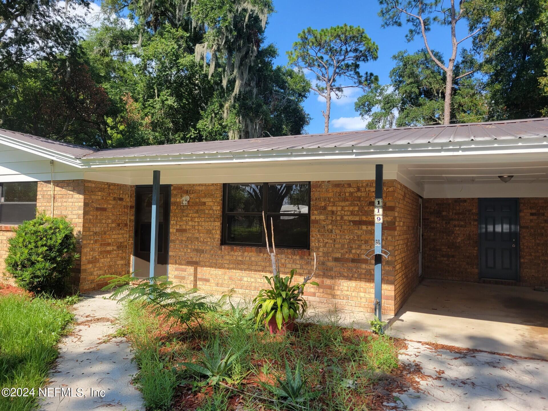 front view of a house with a yard