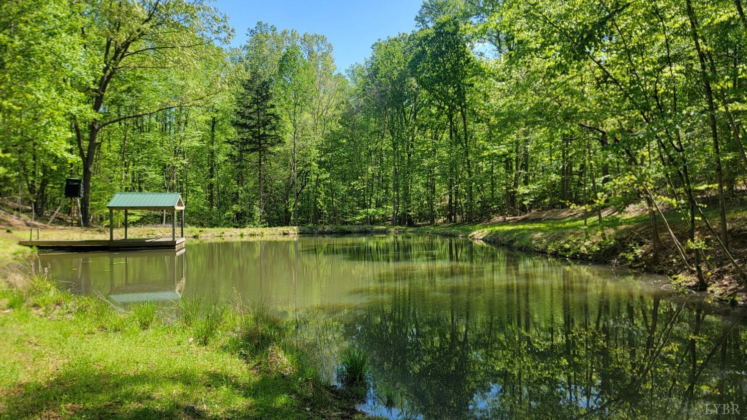 a view of a lake with houses in background