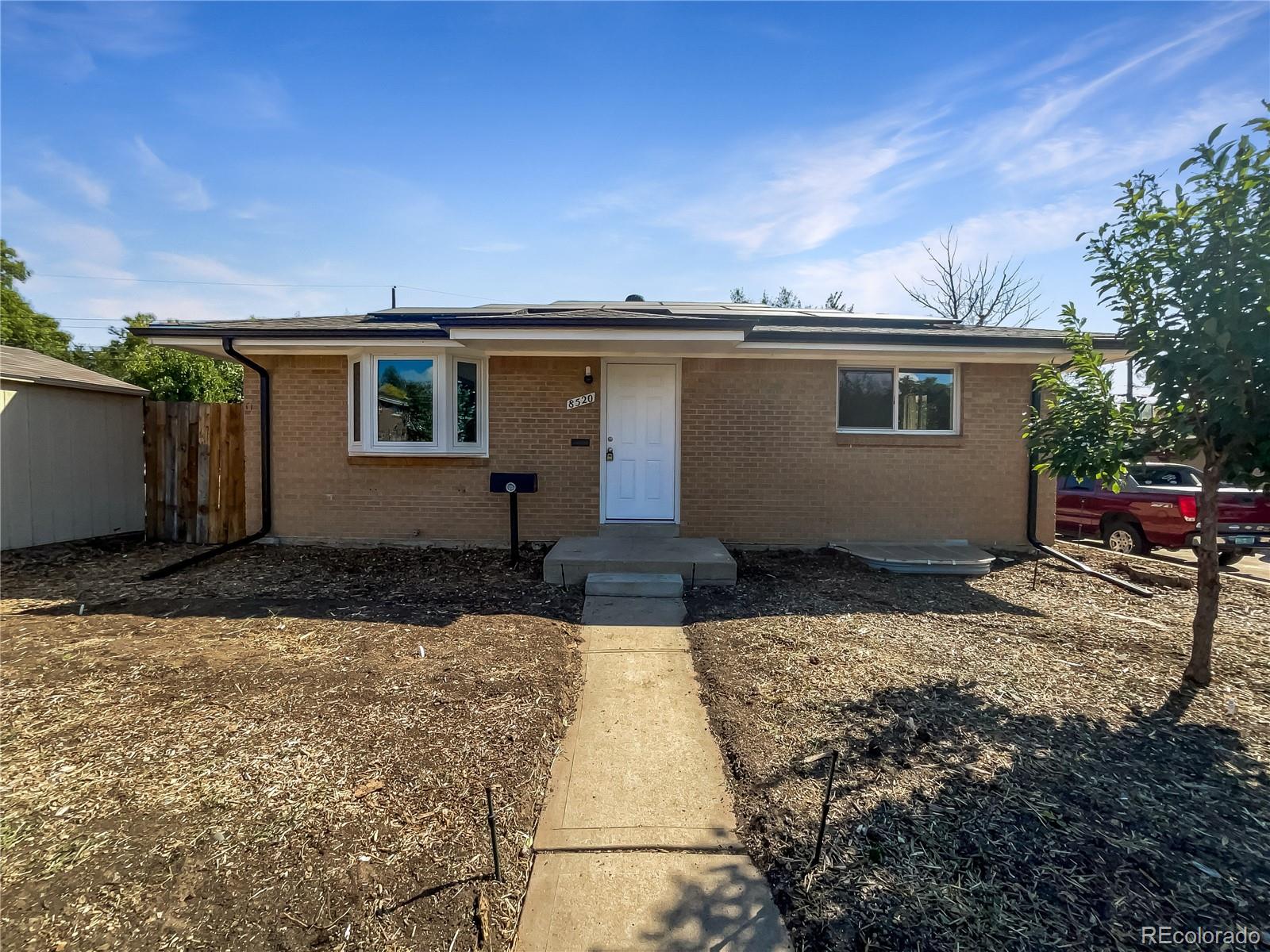 a backyard of a house with yard and garage