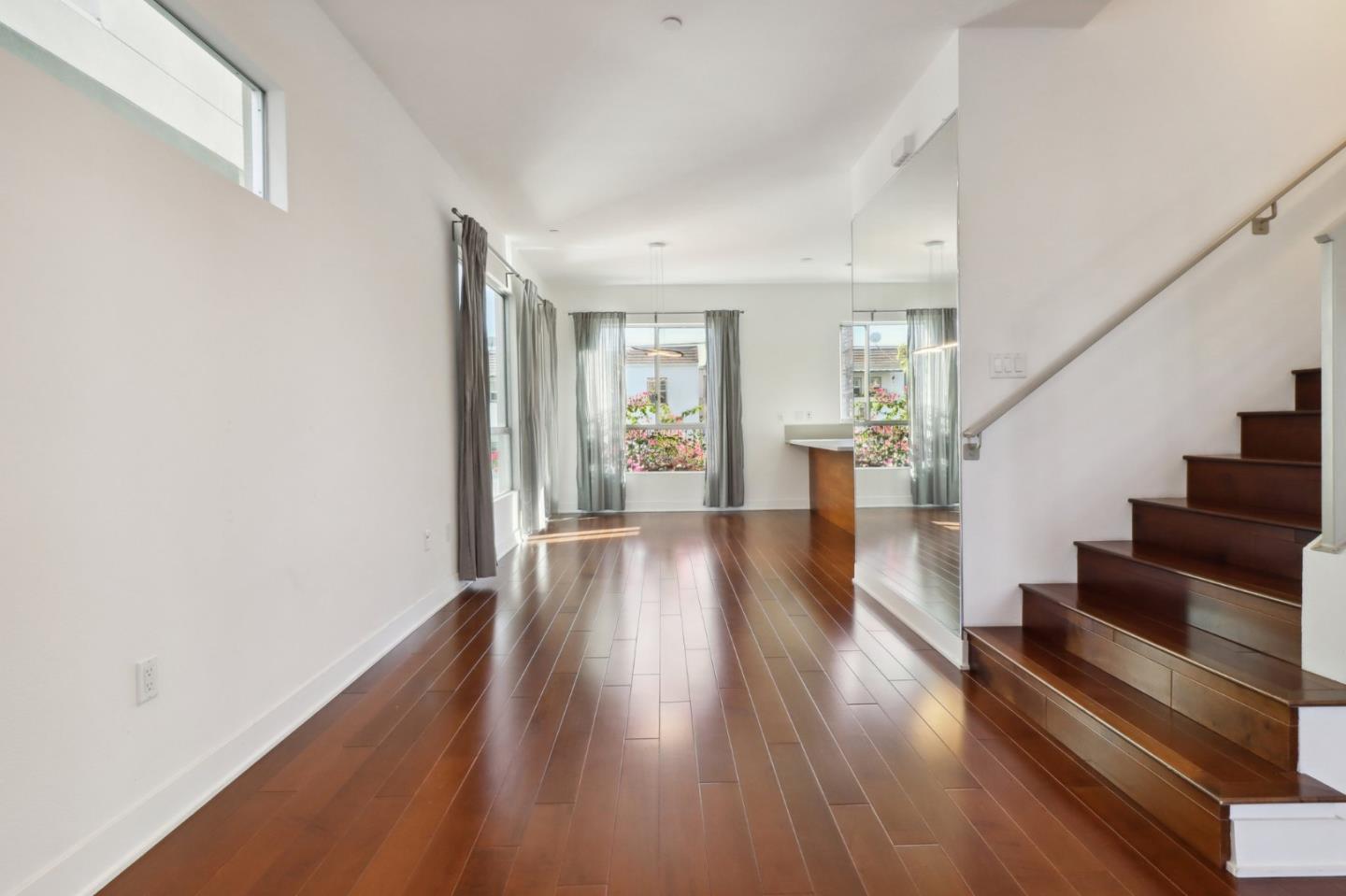 a view of an entryway with wooden floor