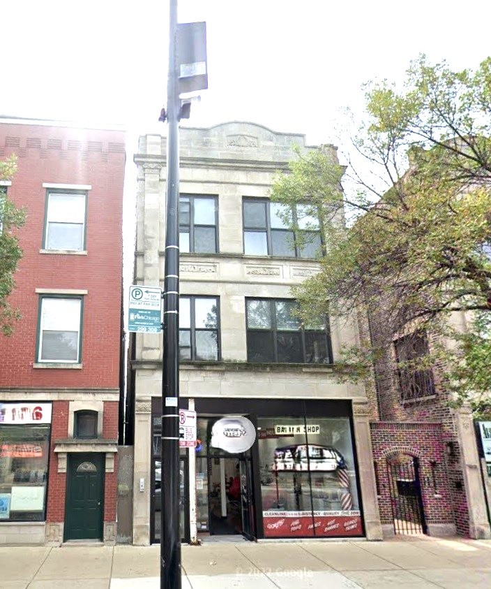 a view of a building with a street