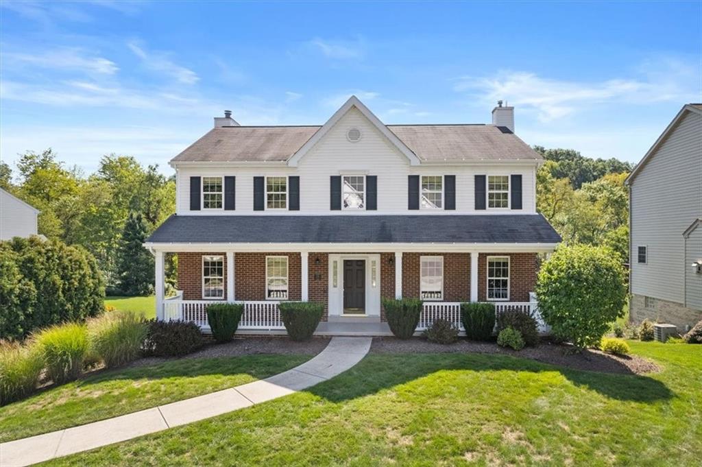 front view of a house with a yard