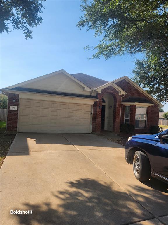 a front view of a house with parking space