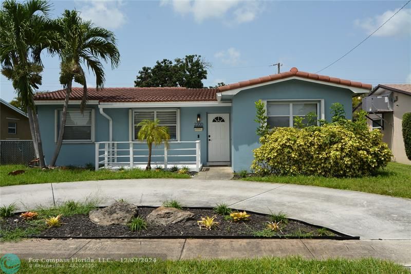 front view of a house with a small yard