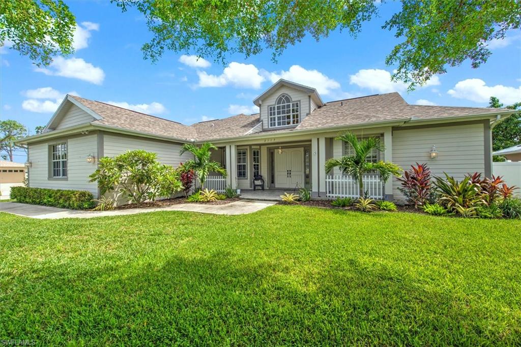 a front view of a house with garden