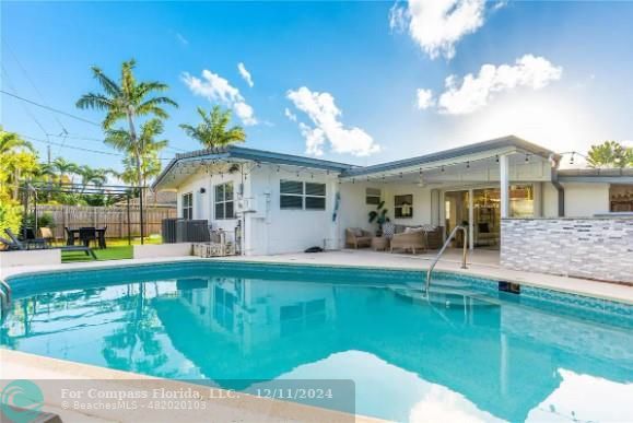 a view of a house with a swimming pool