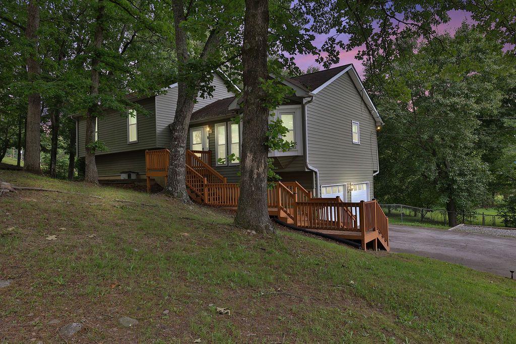 a view of a house with a yard porch and sitting area