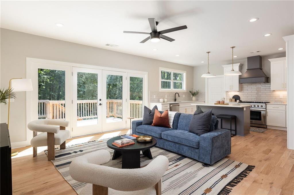 a living room with furniture and a large window