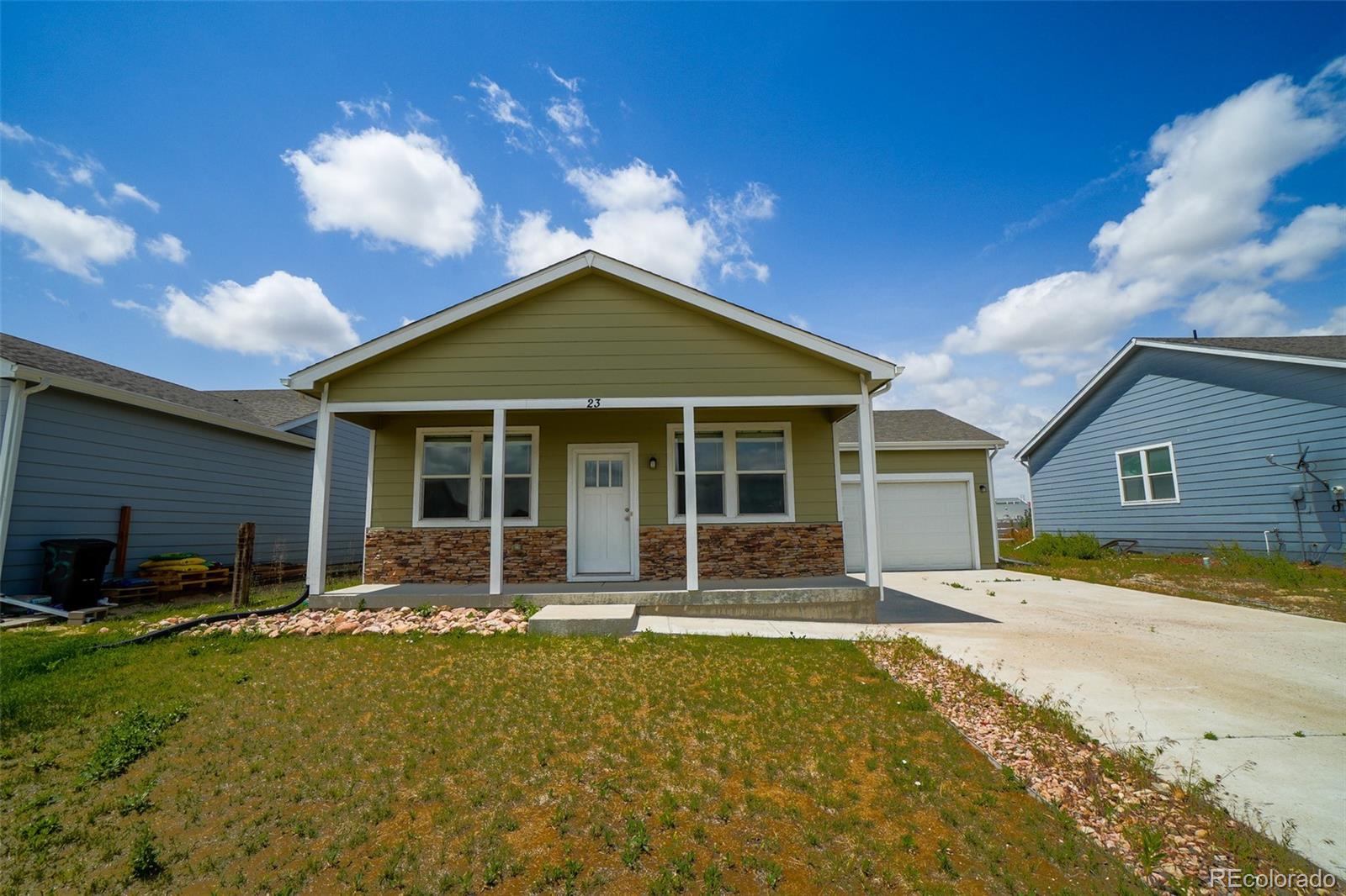 a front view of house with yard outdoor seating and barbeque oven