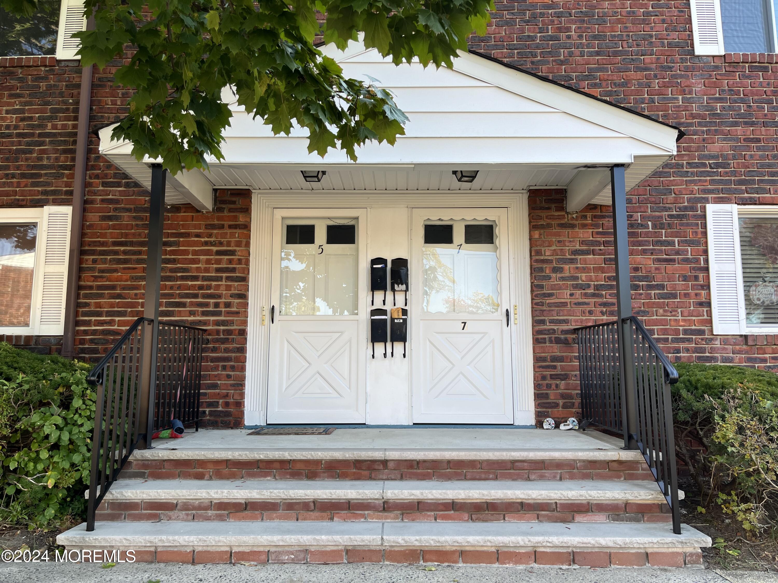 a front view of a house with a garage