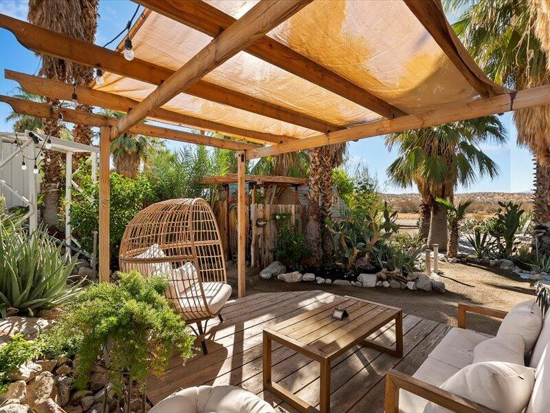 a view of backyard with swimming pool table and chairs