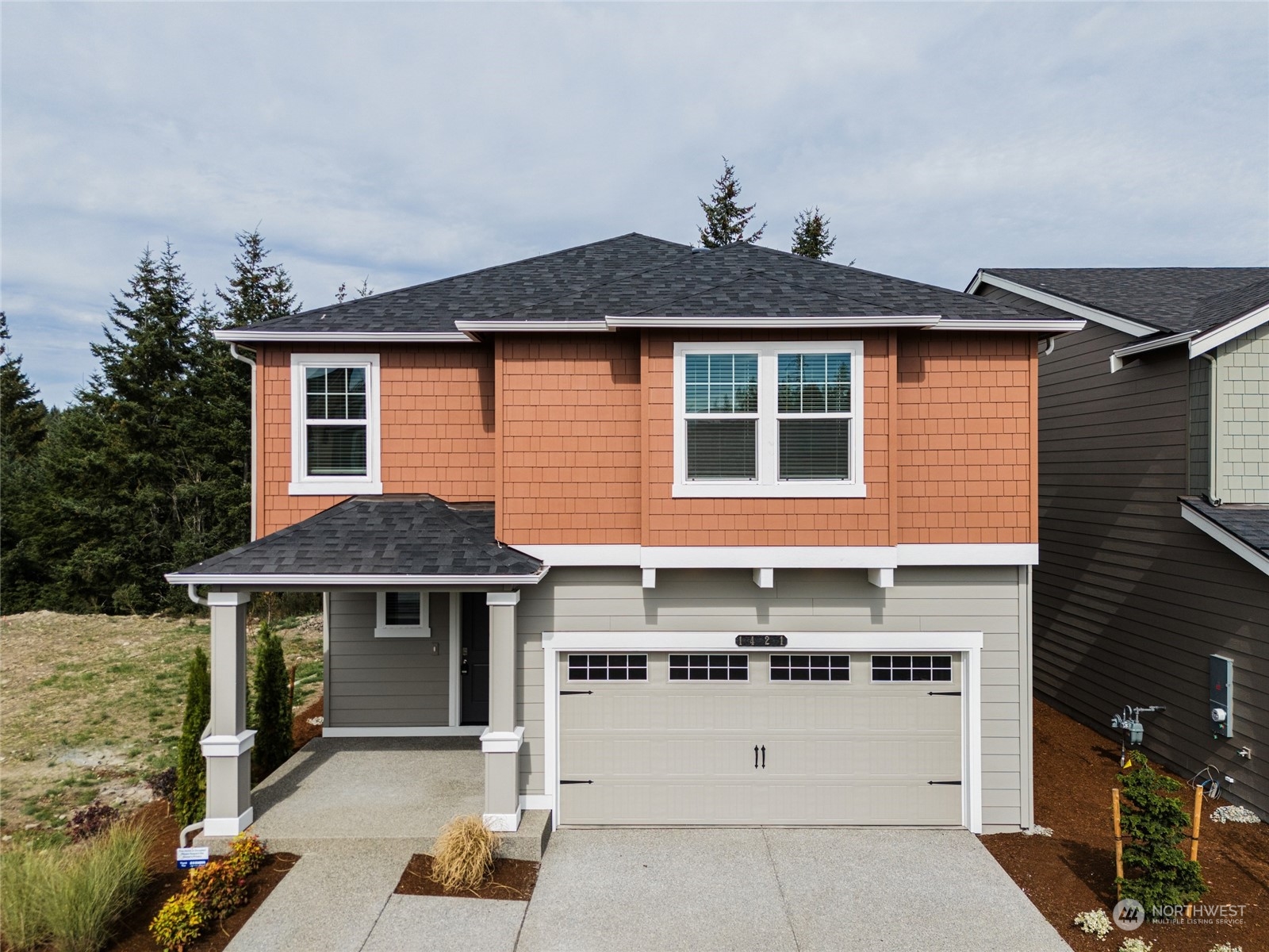 a front view of a house with a yard