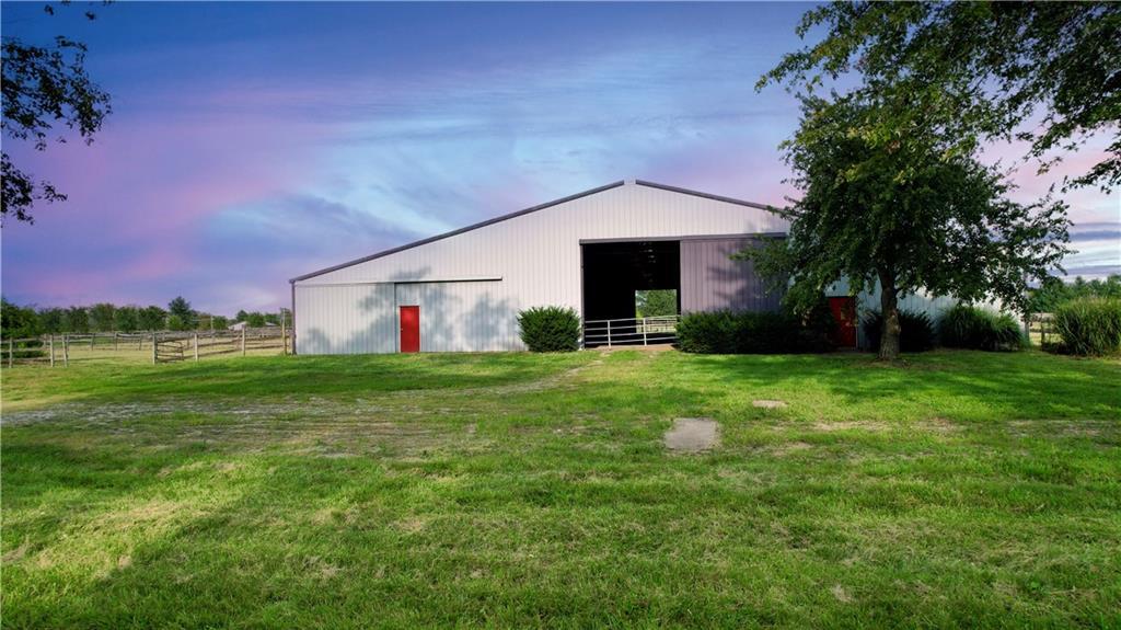 a view of an house with backyard space and garden