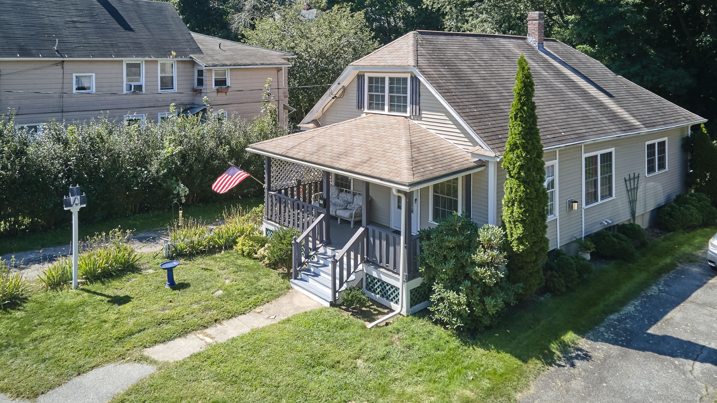 a aerial view of a house with a yard and plants