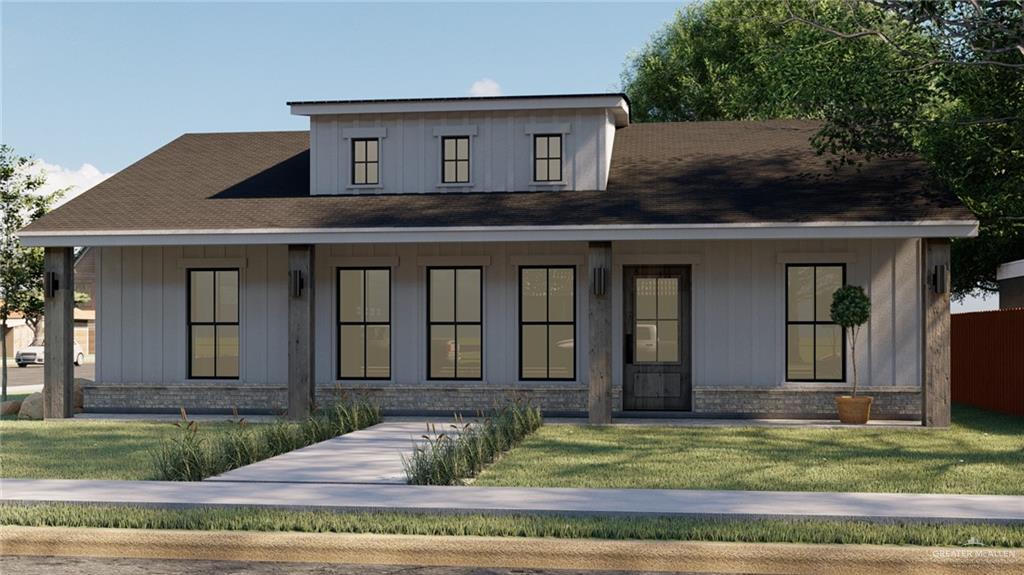 View of front of home featuring covered porch and a front lawn