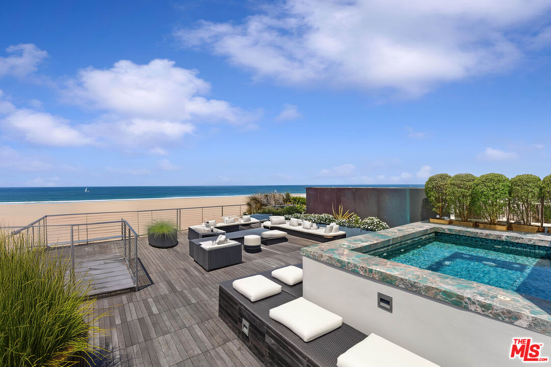 a view of roof deck with patio