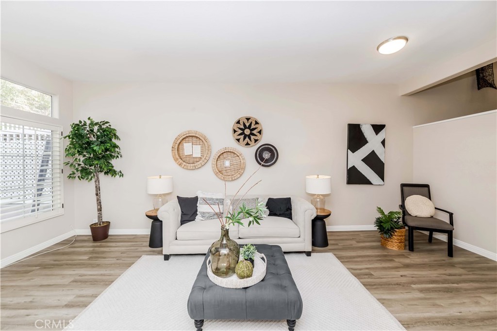 a living room with furniture and a clock