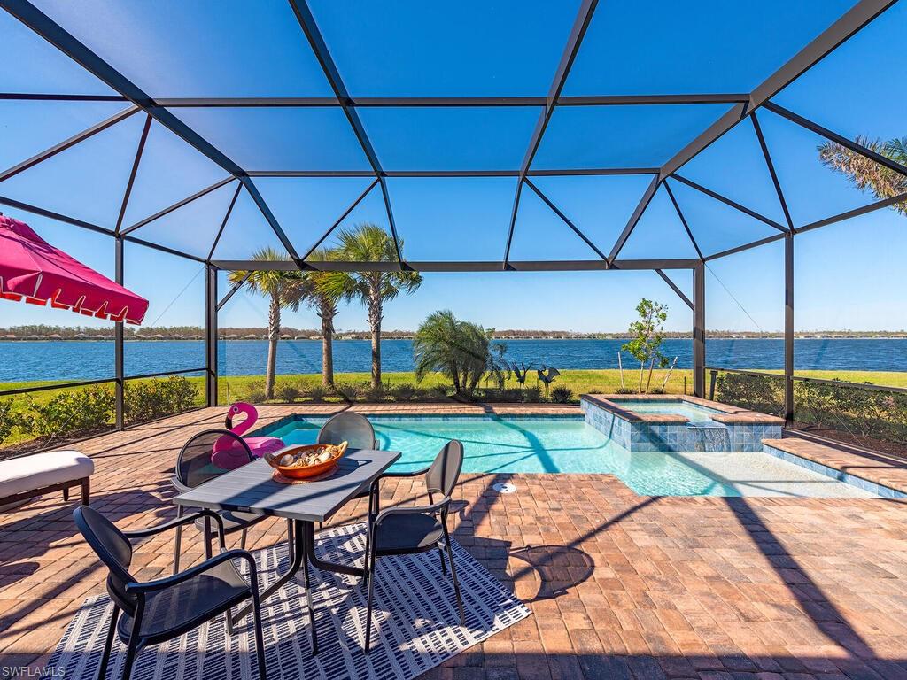 a view of swimming pool with outdoor seating