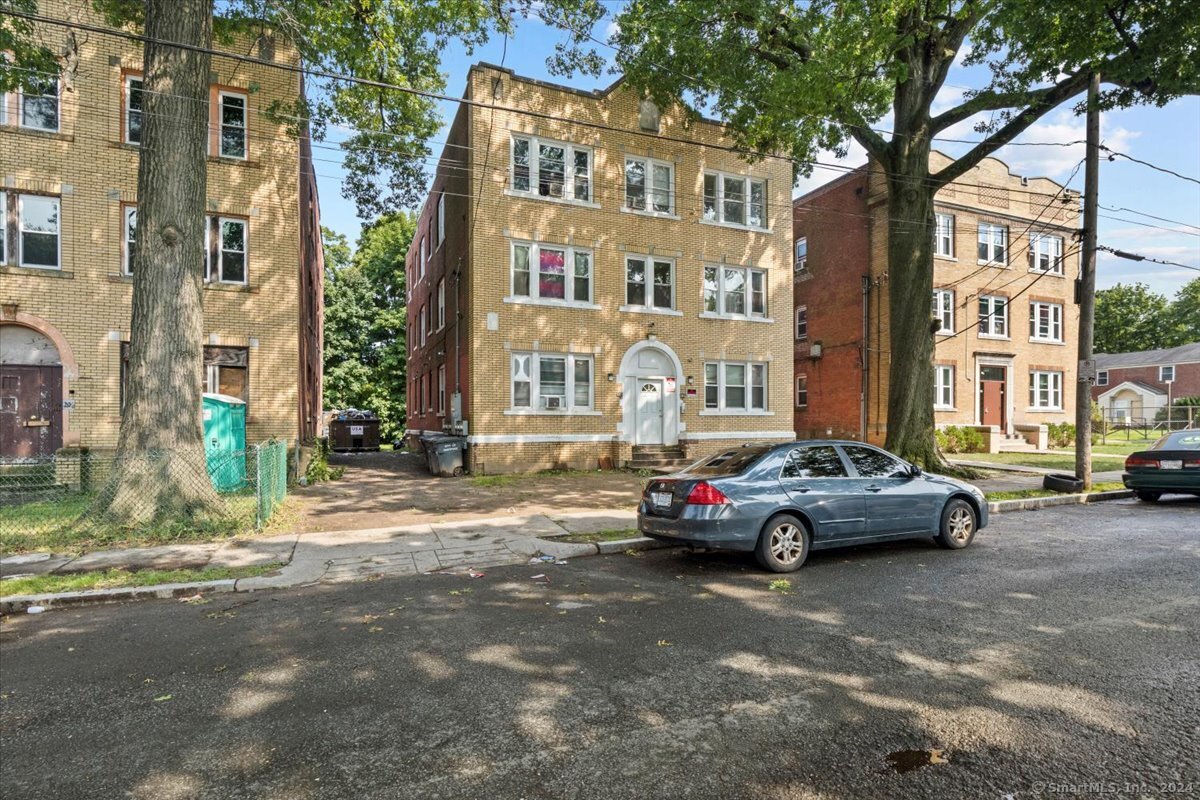 a car parked in front of brick building