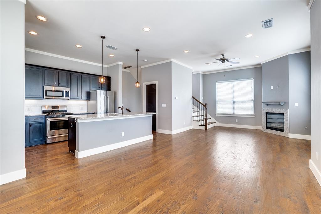 a large kitchen with stainless steel appliances