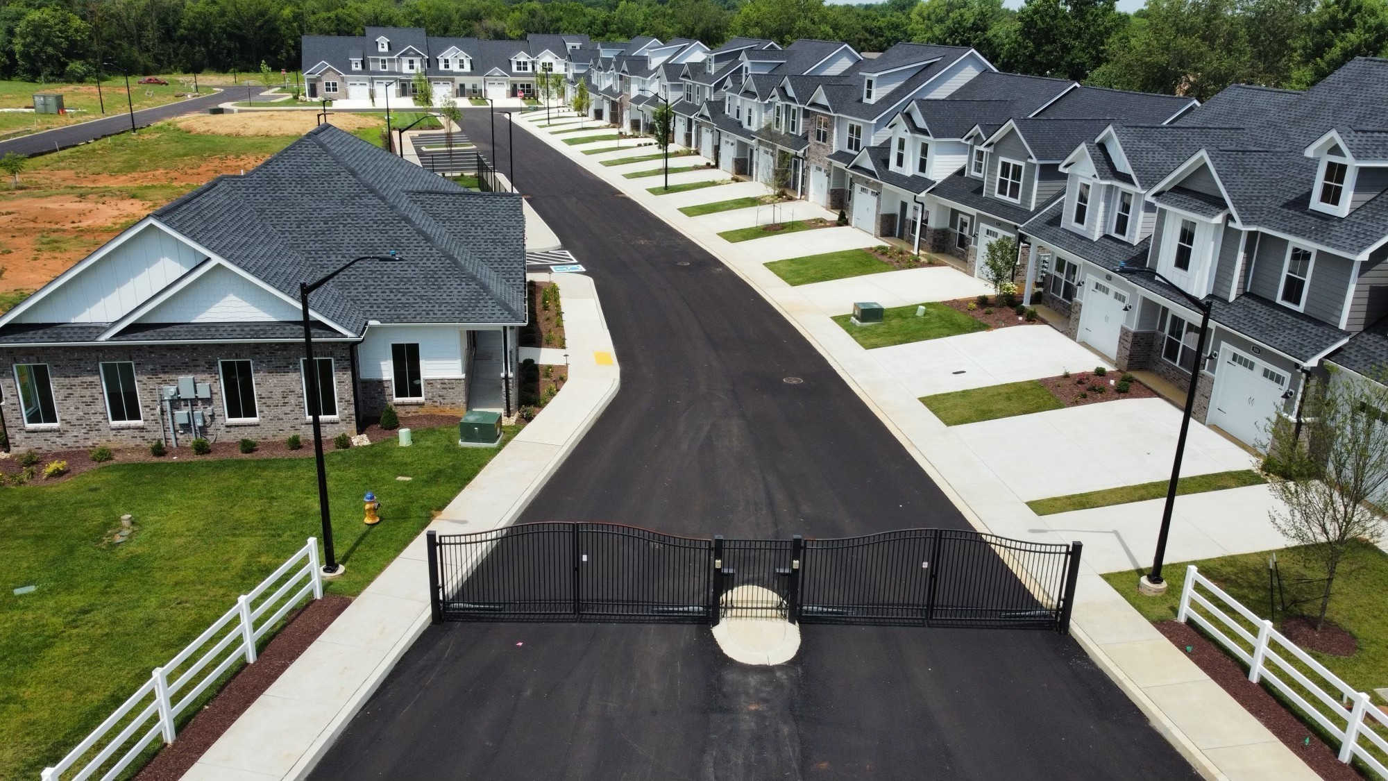 an aerial view of residential house with outdoor space and swimming pool