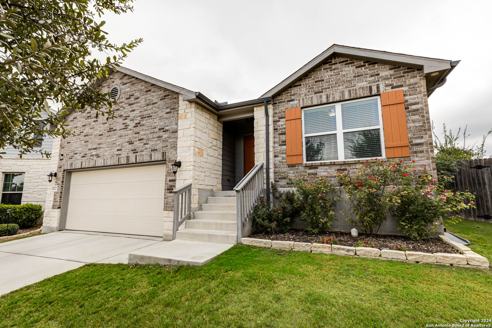 front view of a house with a yard