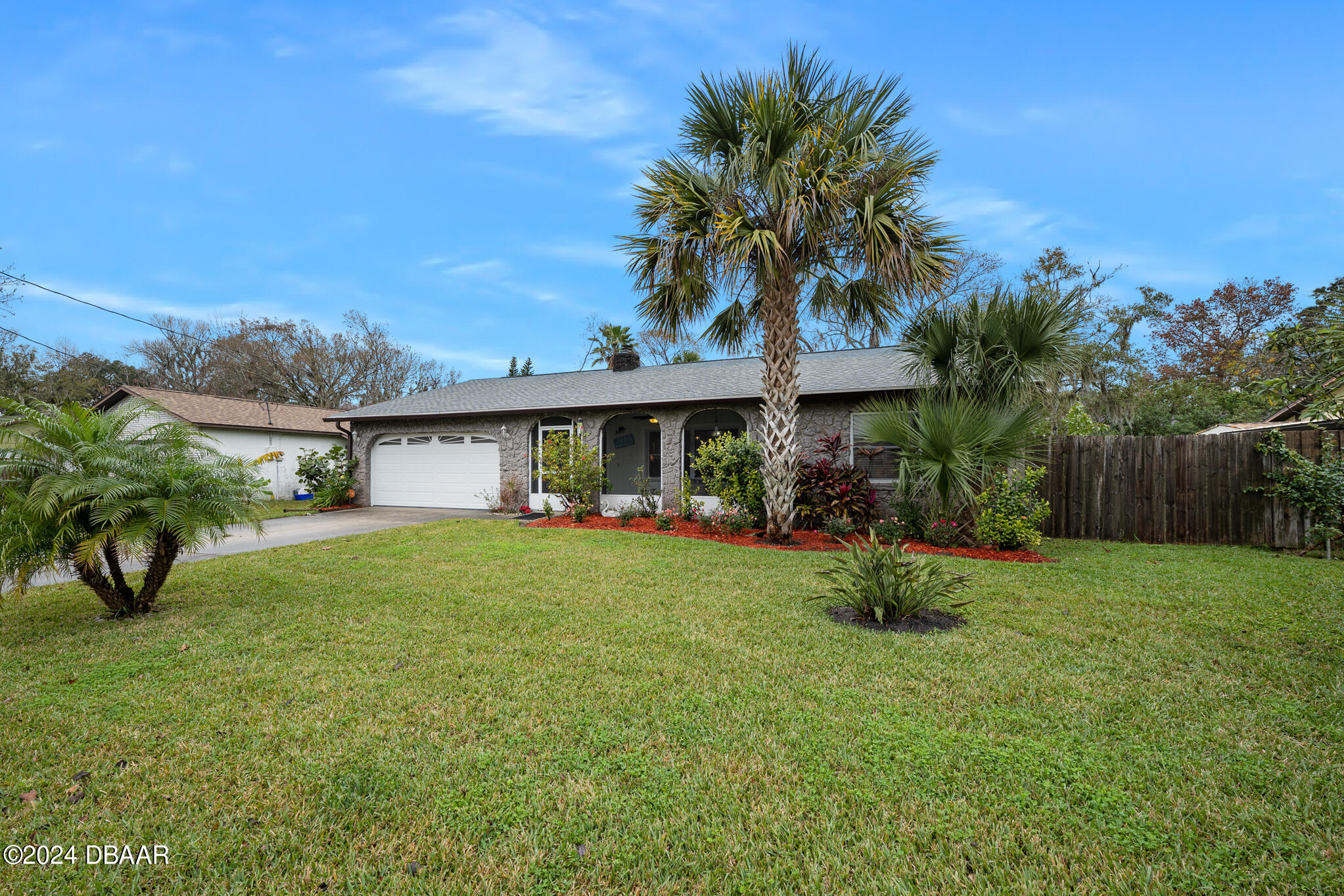 a front view of house with yard and seating area