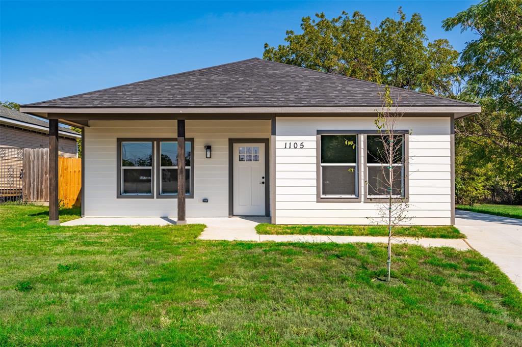 a house that has a big yard in front of it