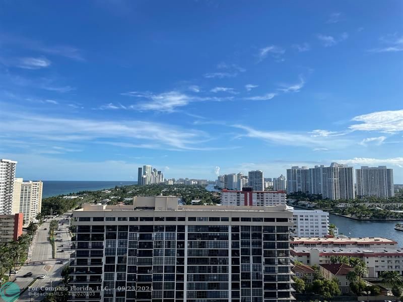 a view of a city with tall buildings