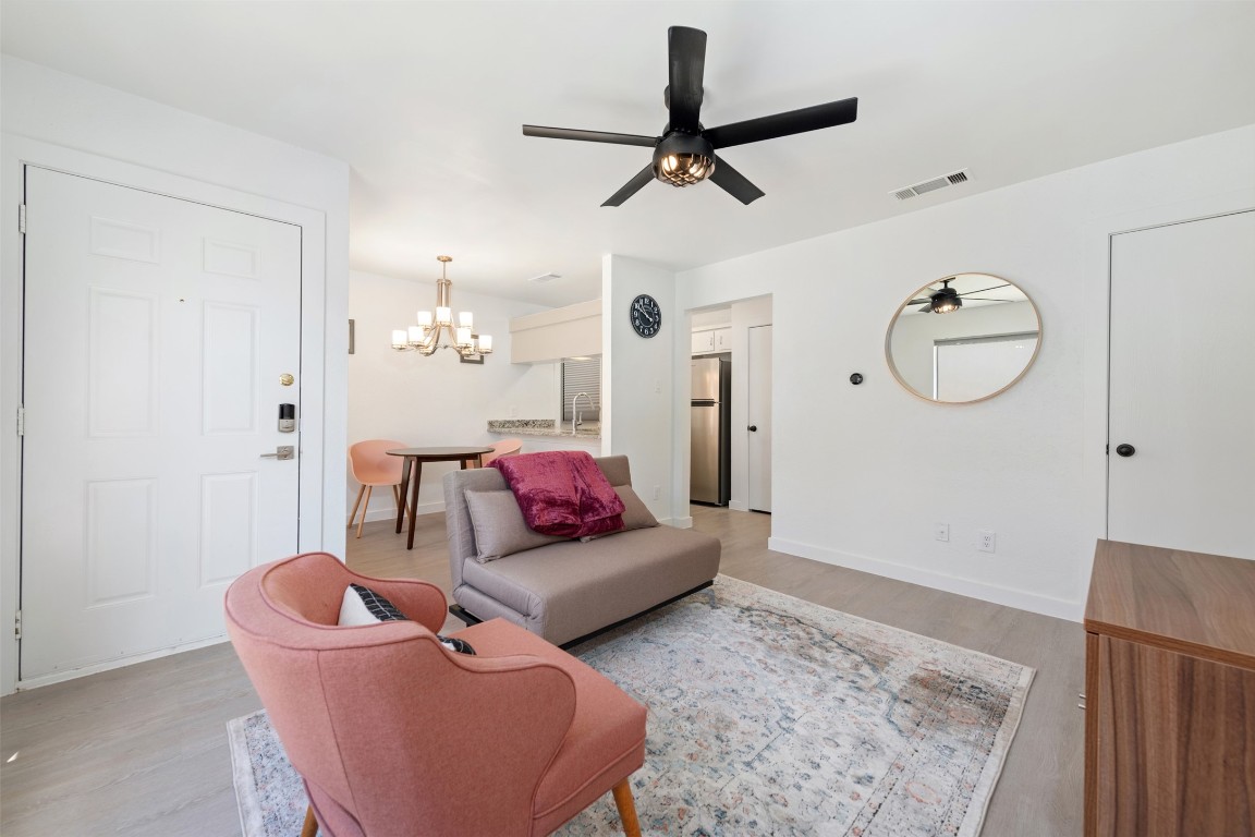 a living room with furniture and a rug