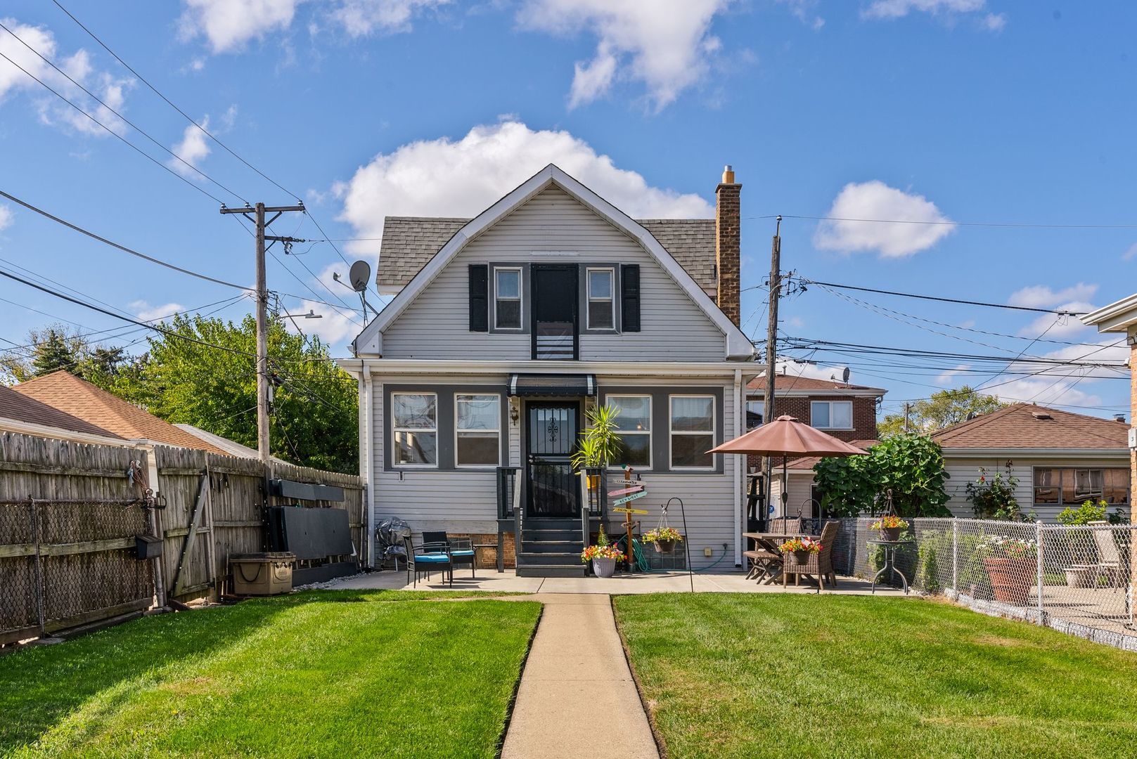 a view of a house with a yard and plants