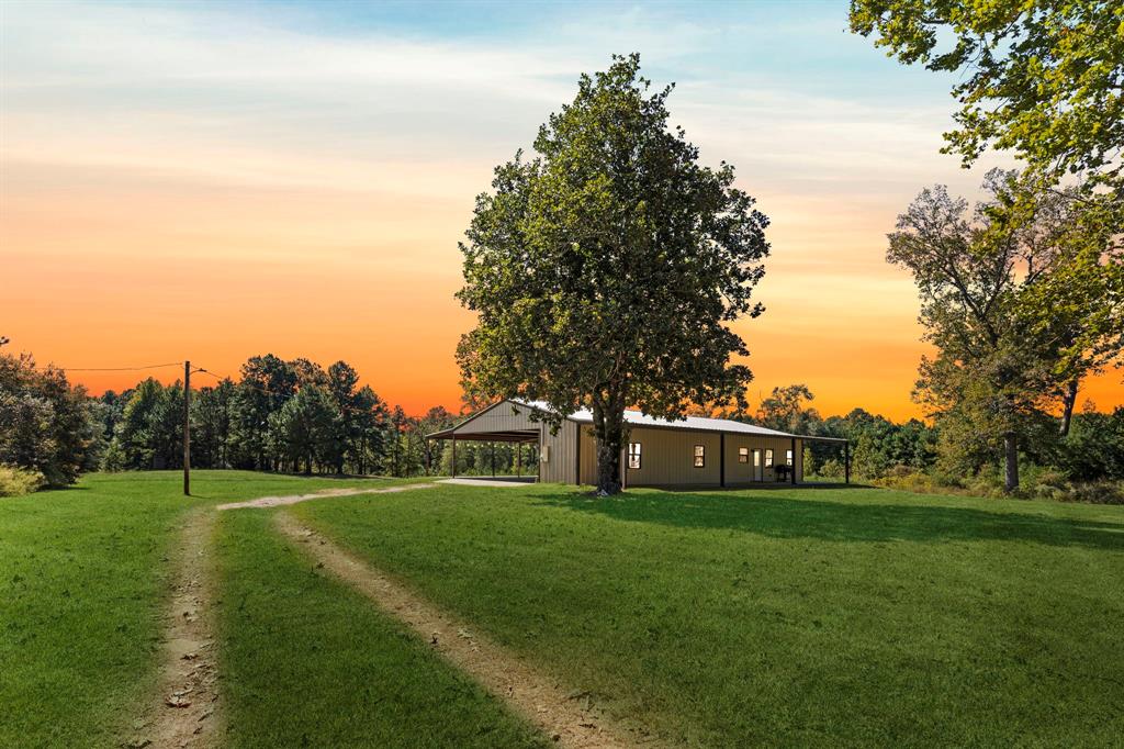 a view of a house with a big yard