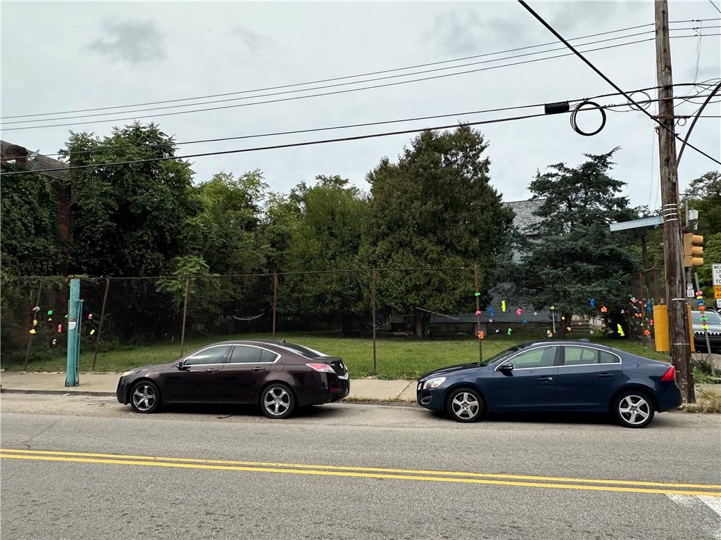 a view of a car parked in front of a house