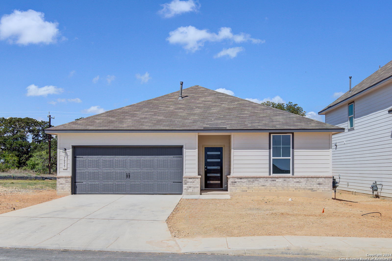 a front view of a house with a garage