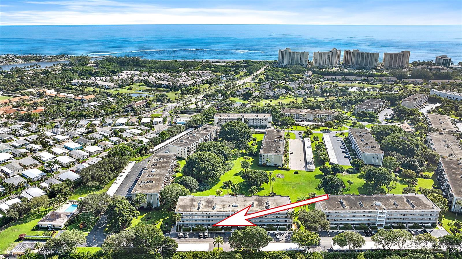 an aerial view of residential building and lake