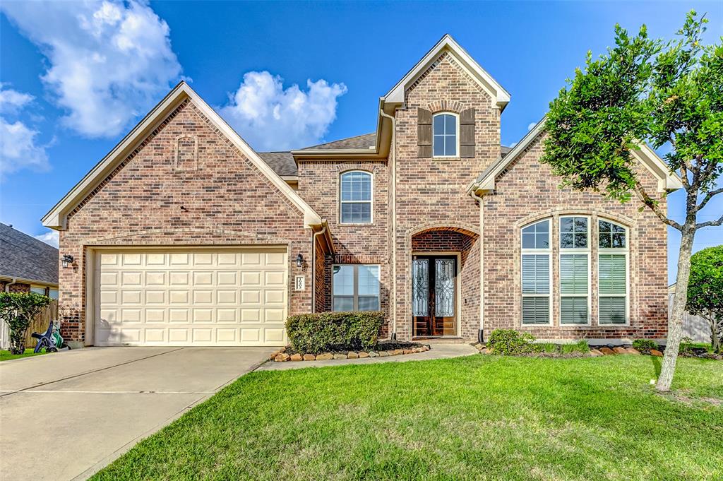 Welcome to this spacious 5-bedroom home featuring an elegant front door that sets the tone for the warmth and style you'll find throughout. EXTERIOR FROONT * BRICK * BUILD 2015.