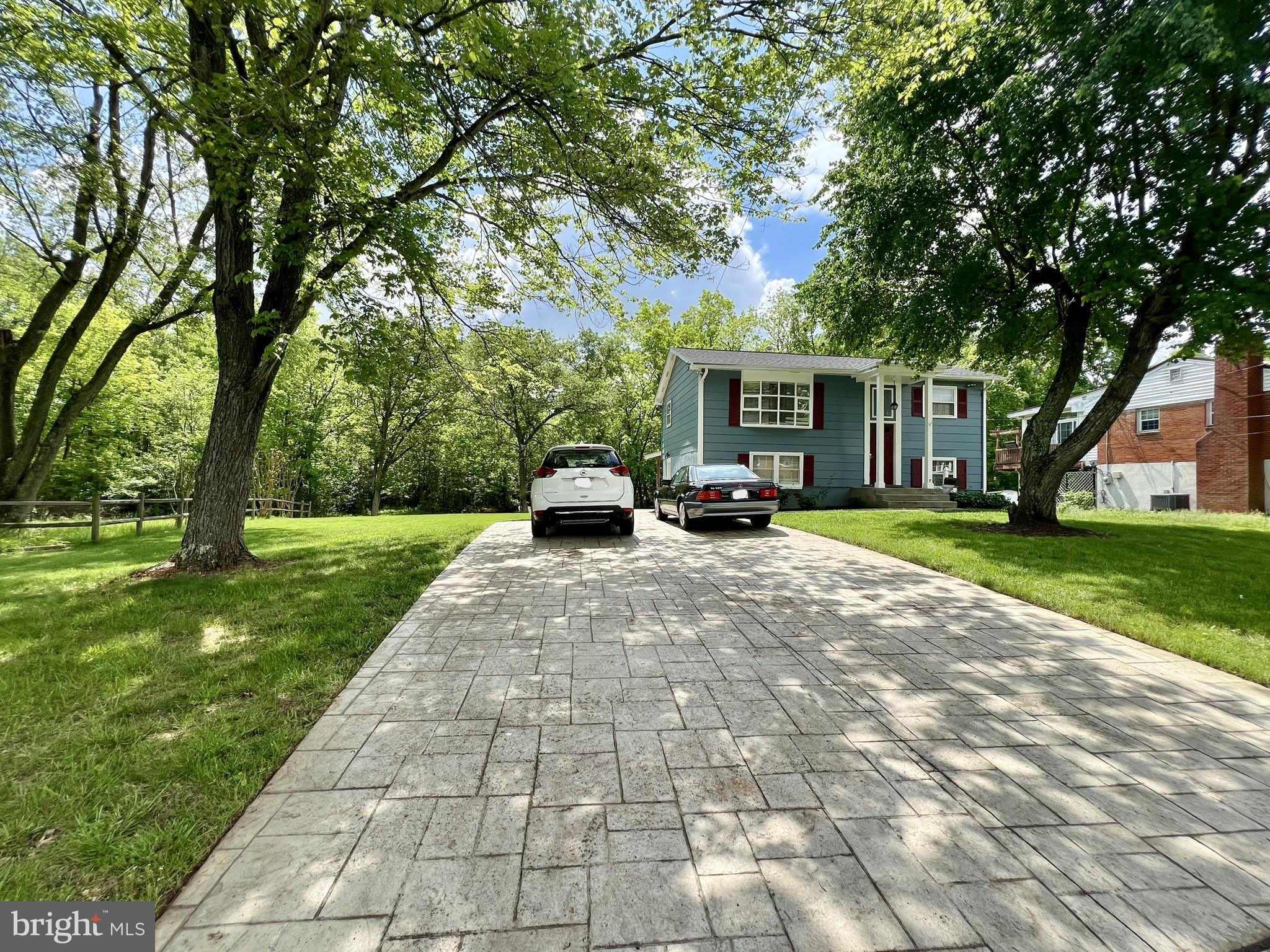 a view of house with yard and entertaining space