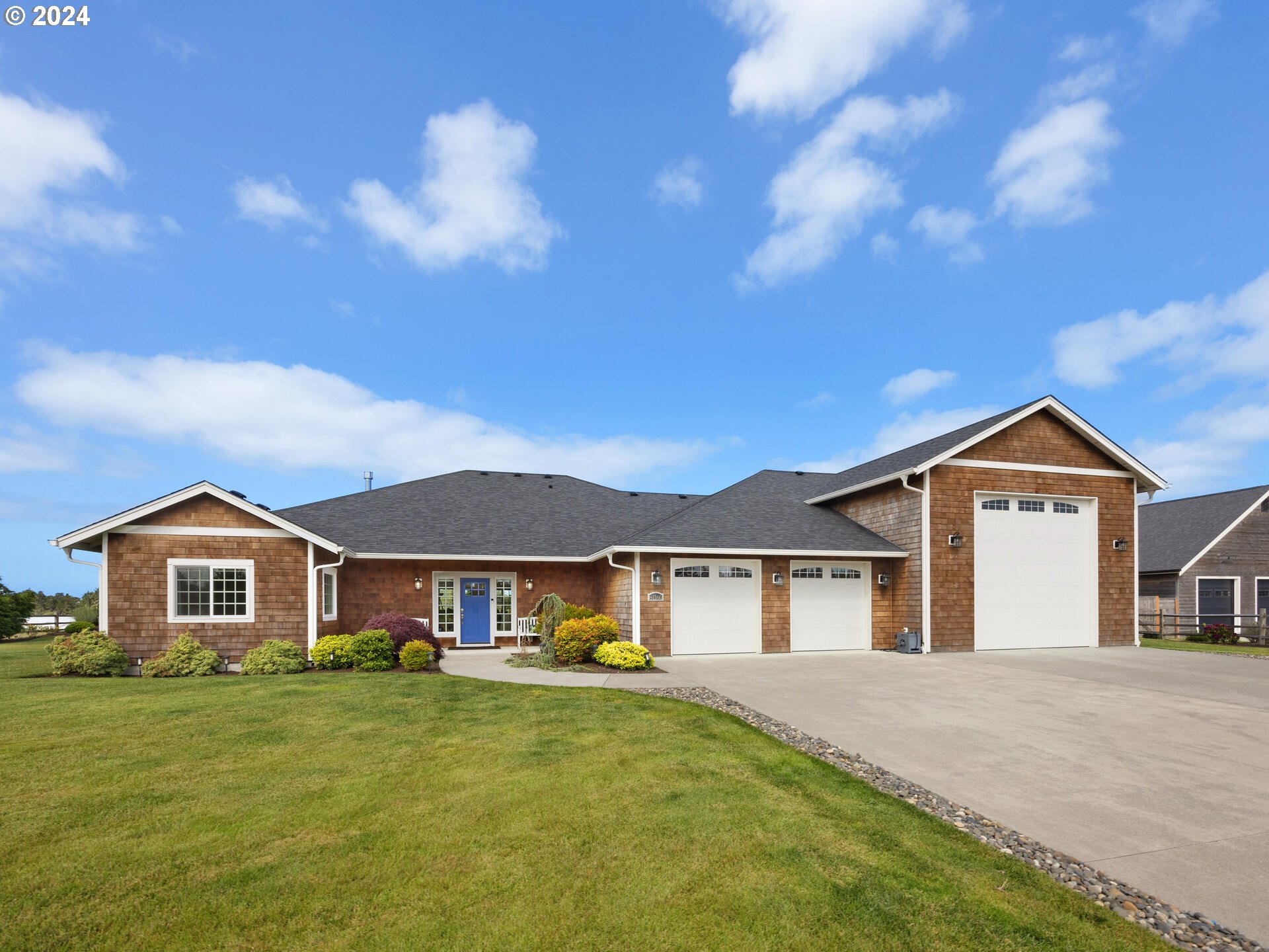 a front view of a house with a yard