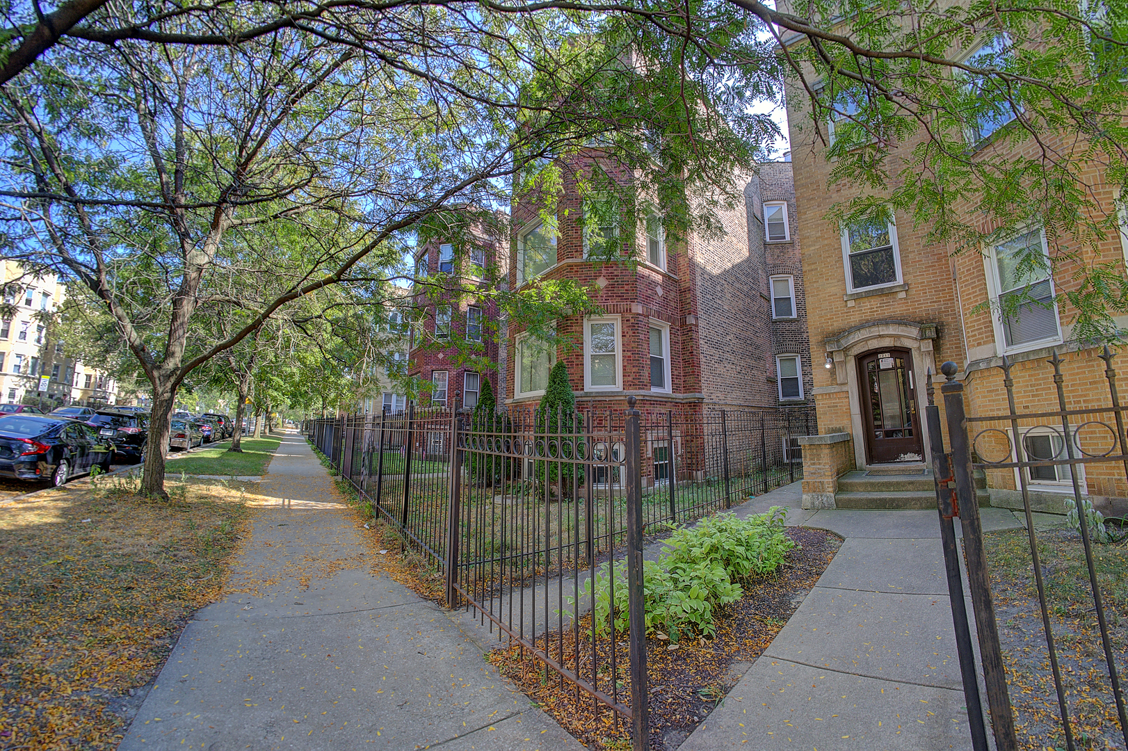 a view of a pathway of a house with a yard and pathway