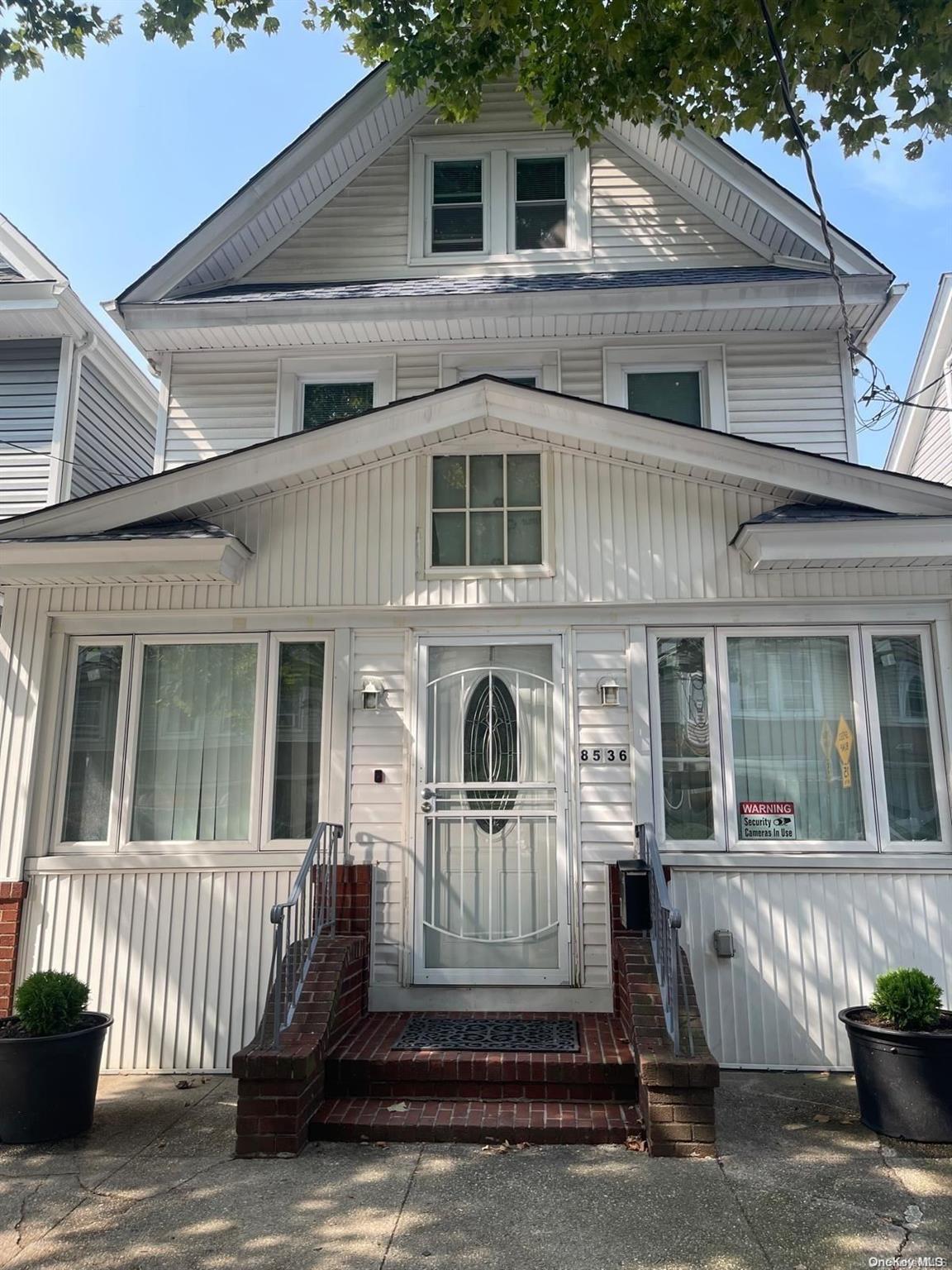 a front view of a house with a porch